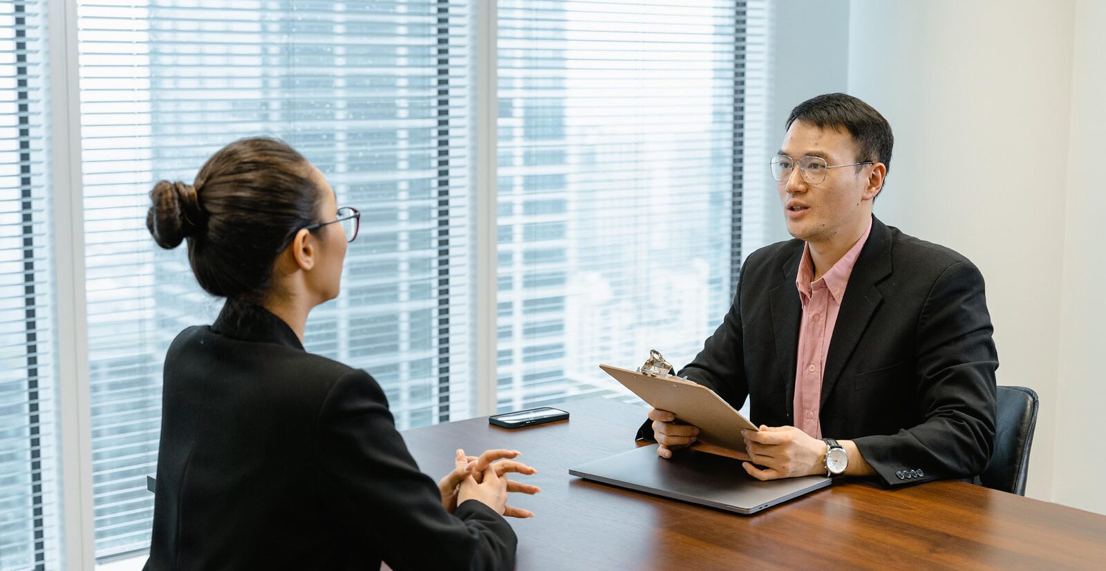 A job interview between a hiring manager and a candidate
